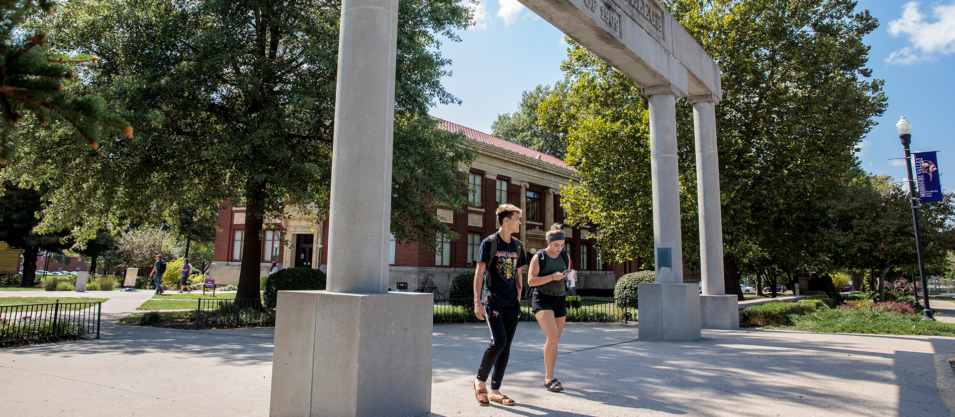 Visit Missouri Valley University Two students walking through a campus colonnade