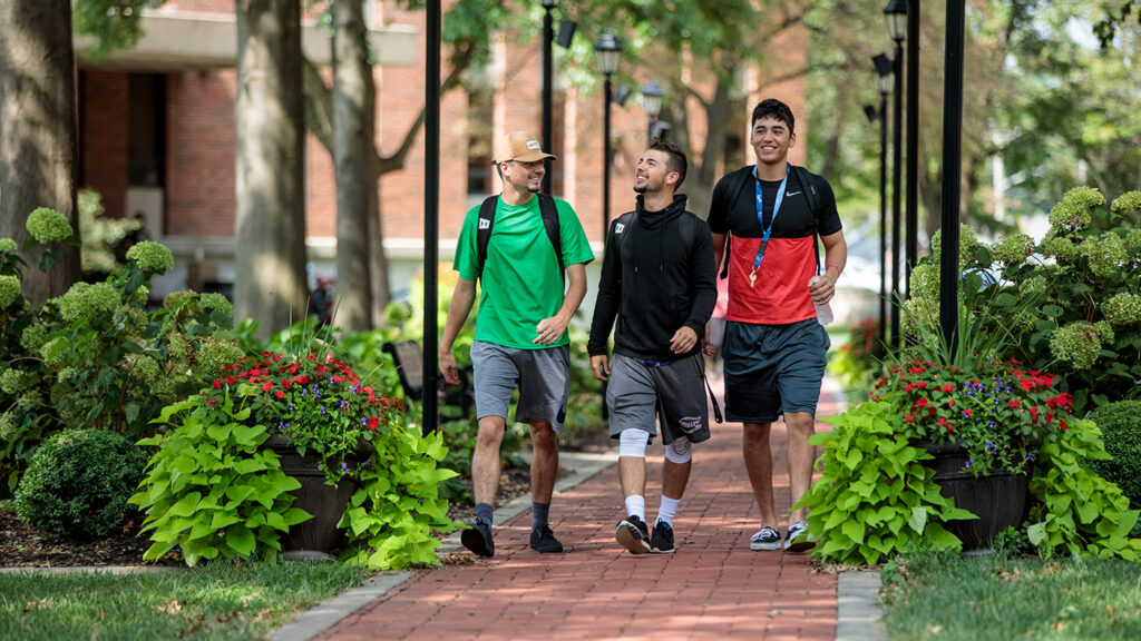 Visit Missouri Valley University A group of students walking along a brick campus path