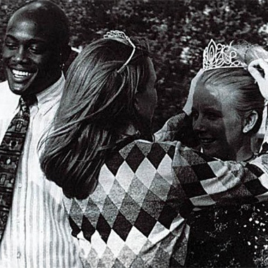 Murrell Library & Academic Support Center Archival yearbook photo of smiling students embracing at a homecoming celebration, one wearing a crown.